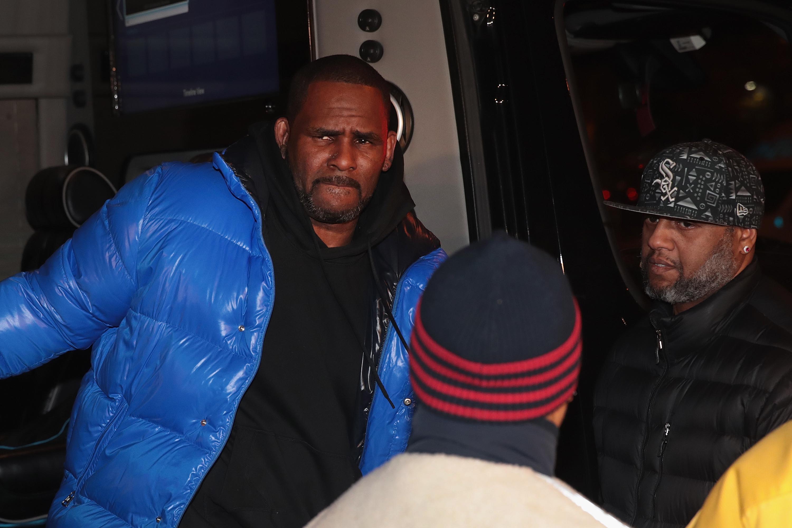 R. Kelly, charged with sexually abusing underage victims, has turned himself in