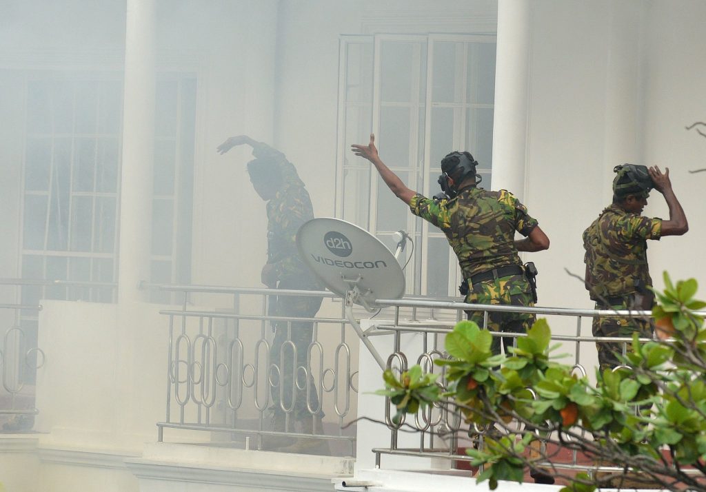 Sri Lankan Special Task Force members during a raid on a house in a suburb of Colombo on Sunday.