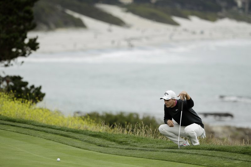 U.S. Open: Rickie Fowler tied for the lead in soft conditions at Pebble Beach