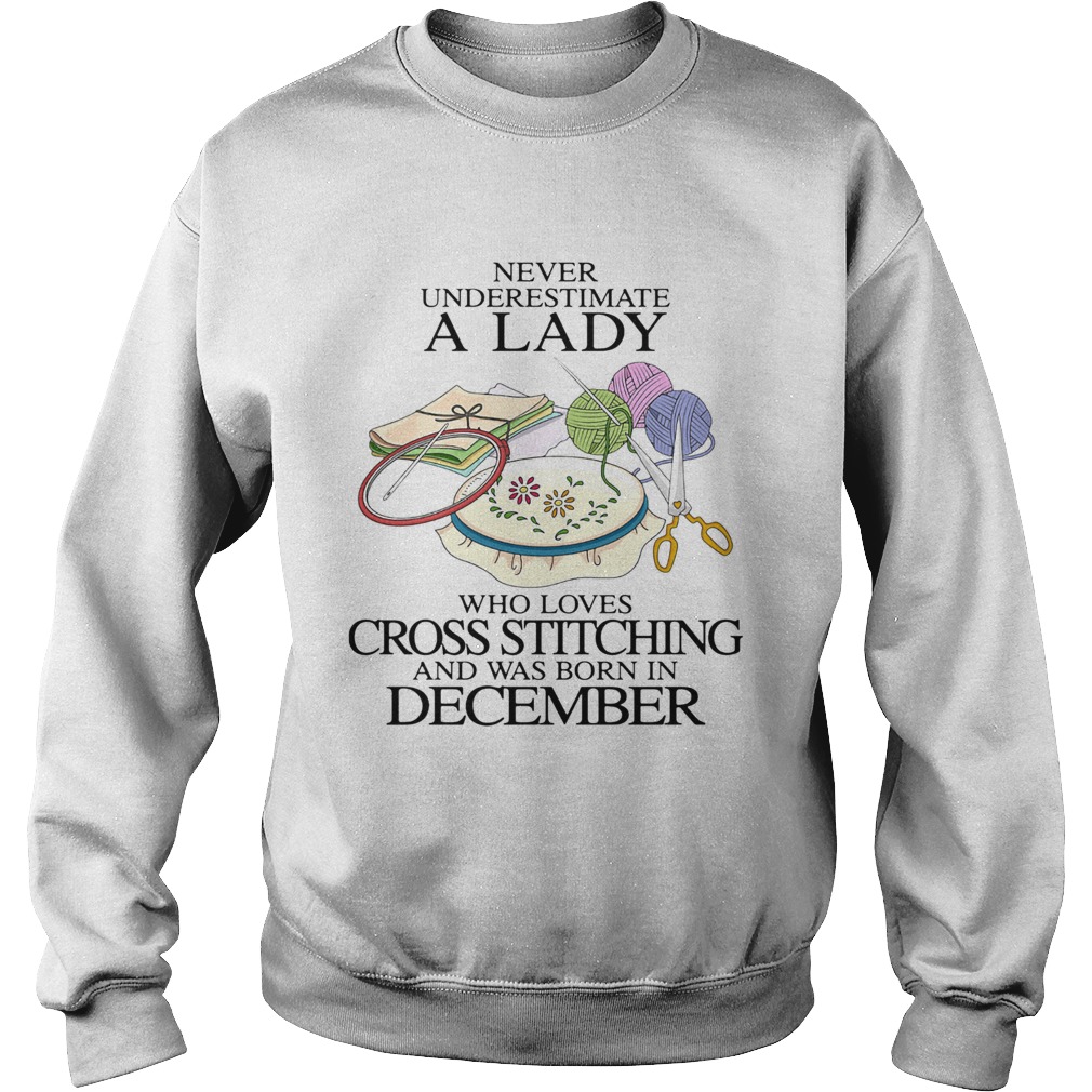Never underestimate a lady who loves cross stitching and was born in december Sweatshirt