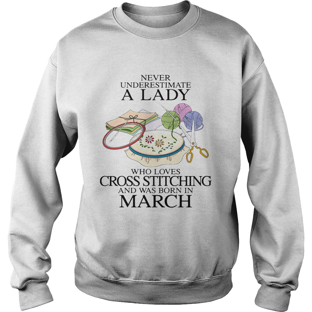 Never underestimate a lady who loves cross stitching and was born in march Sweatshirt