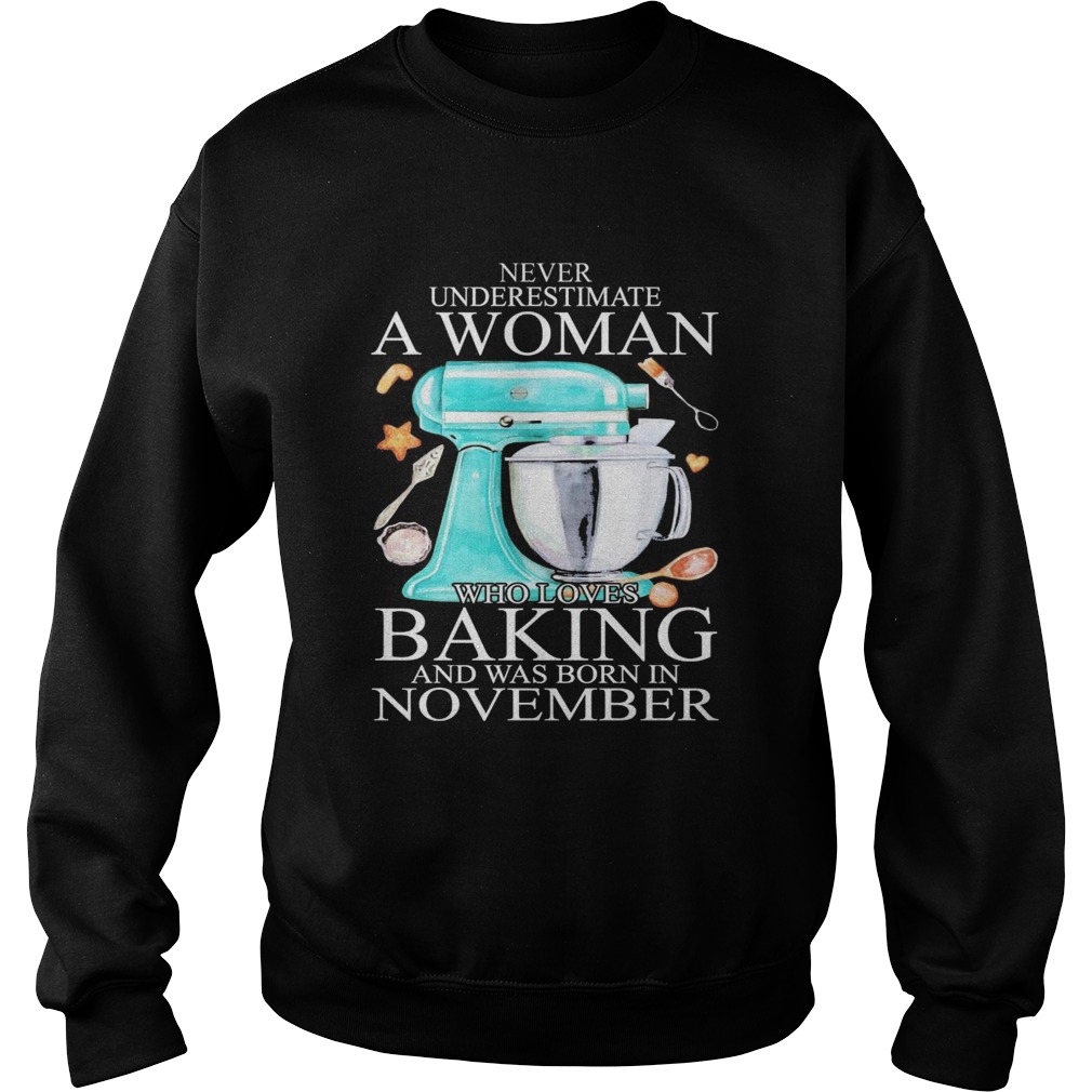 Never underestimate a woman who loves baking and was born in november heart Sweatshirt
