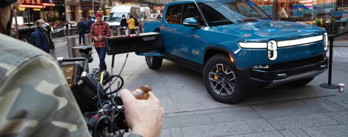The electric automaker Rivian soared in its stock debut. Why there’s so much buzz